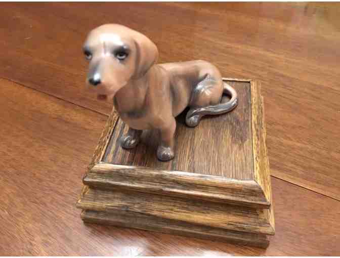 Music box!  Sitting doxie on top playing Impossible Dream!  Vintage!