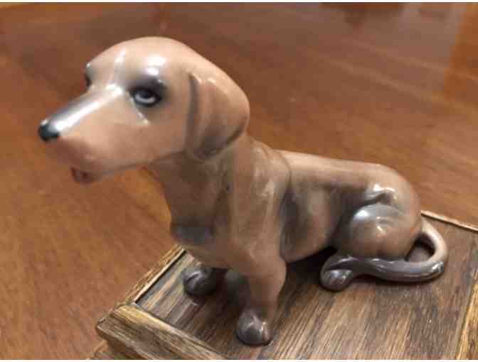 Music box!  Sitting doxie on top playing Impossible Dream!  Vintage!