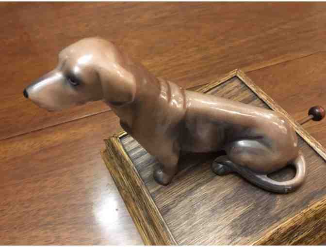 Music box!  Sitting doxie on top playing Impossible Dream!  Vintage!