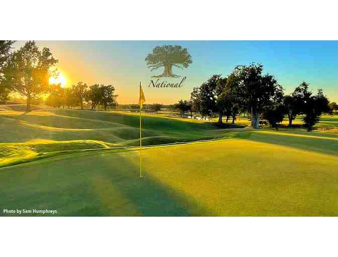 Oak Tree National - a foursome with cart and range balls
