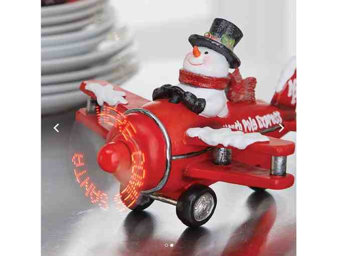 Animated Musical Snowman in Plane