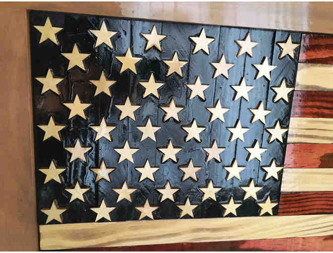 US flag art made from wood fragments reclaimed from Easton reconstruction projs.