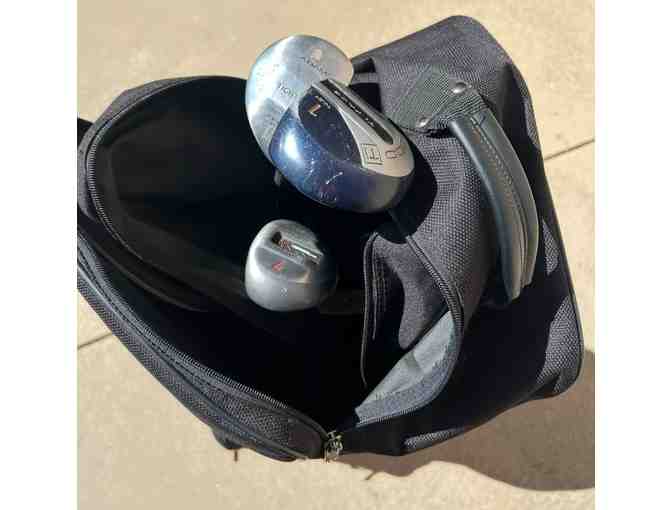 Wheeled Golf Travel Bag with assorted clubs
