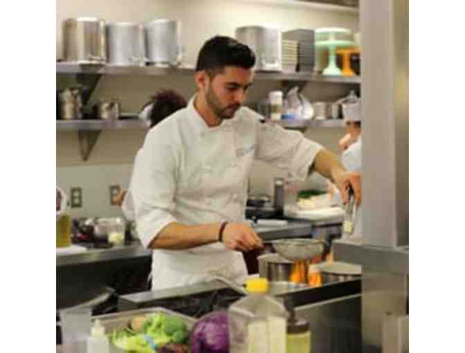 $100 dollar gift certificate for the restaurant or a class at The New School of Cooking