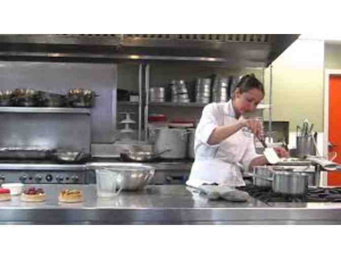 $100 dollar gift certificate for the restaurant or a class at The New School of Cooking