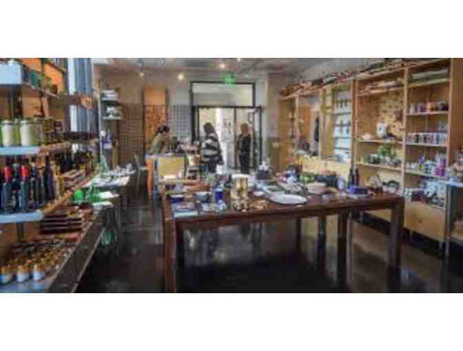 $100 dollar gift certificate for the restaurant or a class at The New School of Cooking