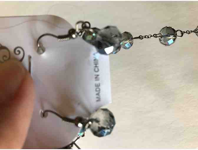 Blue beaded necklace with blue pendant plus bracelet and earrings