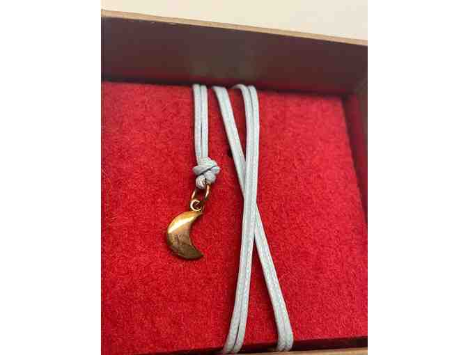 Exquisite DoDo rose gold moon charm on light blue cord. Brand new. (JP)