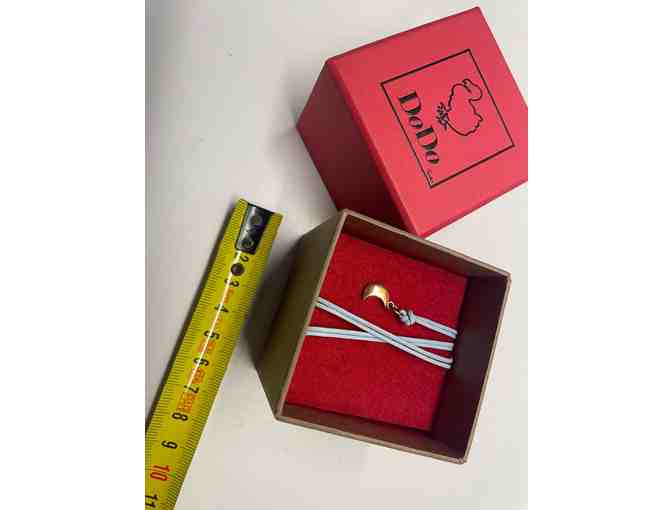 Exquisite DoDo rose gold moon charm on light blue cord. Brand new. (JP)