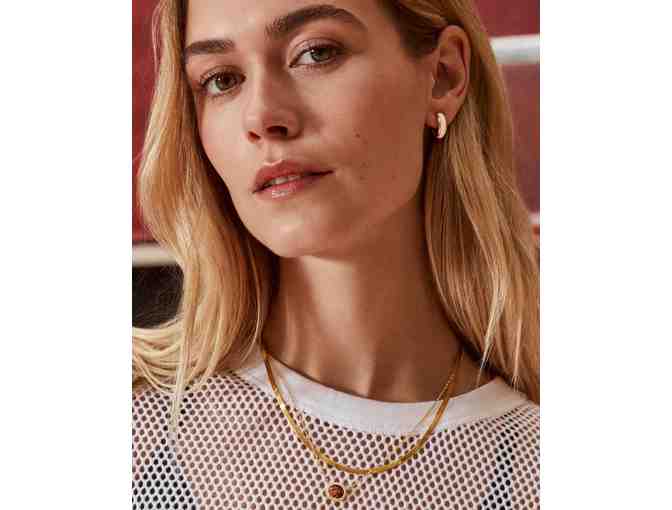 Ainsley Huggie Earrings in Gold with White Mother of Pearl from Kendra Scott