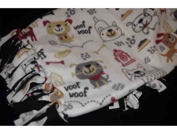 Stay Warm with This Fleece Blanket Featuring Dogs