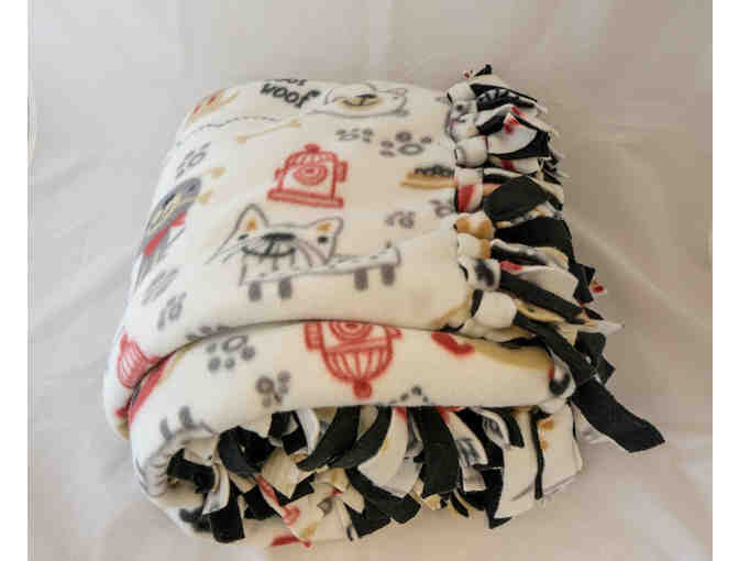 Stay Warm with This Fleece Blanket Featuring Dogs