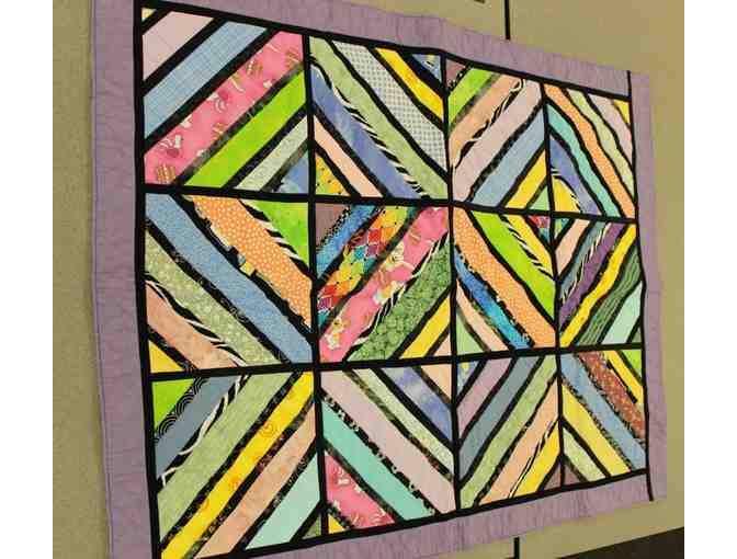 Handmade Lap Quilt in a Geometric Pattern with Purple Accents