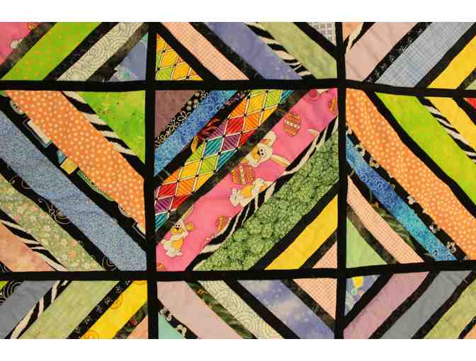 Handmade Lap Quilt in a Geometric Pattern with Purple Accents