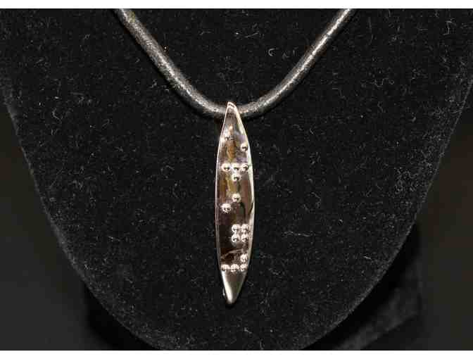 Silver-Plated Braille 'Strength' Pendant on black leather necklace
