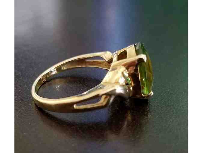 Oval Peridot Ring in a 10K Gold Setting