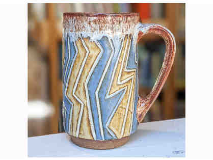 Footed tall mug with wood ash glaze, by Pond Farm student, Pedar Hegland.