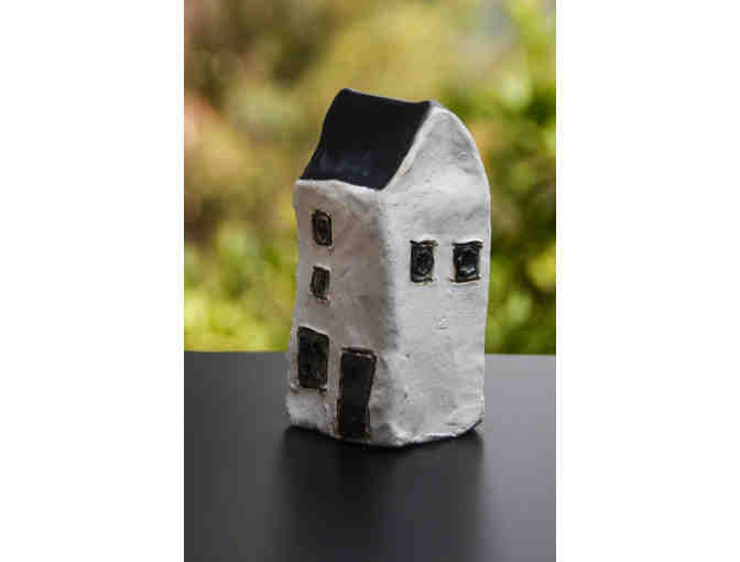 Tall White House with black roof, 3 stories